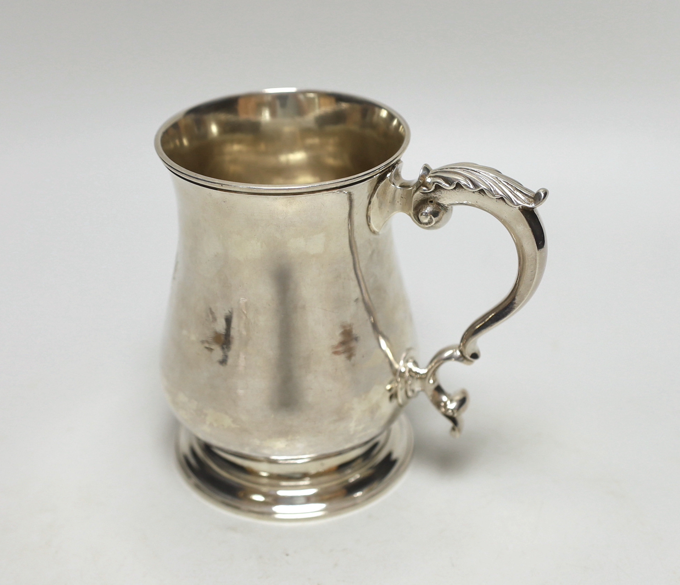 A George II silver baluster mug, with acanthus scroll handle, maker William Tuite, London 1767, 386 grams